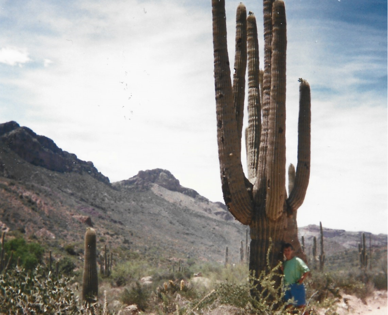 Sally's Mom stands next to a giant Saguaro cactus